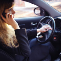 Lady on a cell phone while driving