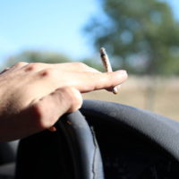 guy smoking while driving
