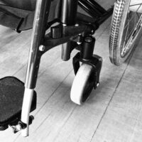 Image of a wheelchair, representing how a West Virginia spinal cord injury lawyer can help victims recover compensation.